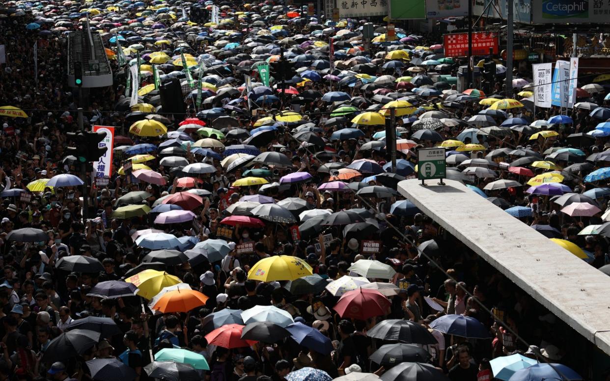 Anti-extradition bill protesters take part in a rally in Hong Kong, China, 21 July 2019. The organizer of the march, the Civil Human Rights Front, is urging the government to set up an independent commission of inquiry to be led by a judge - REX