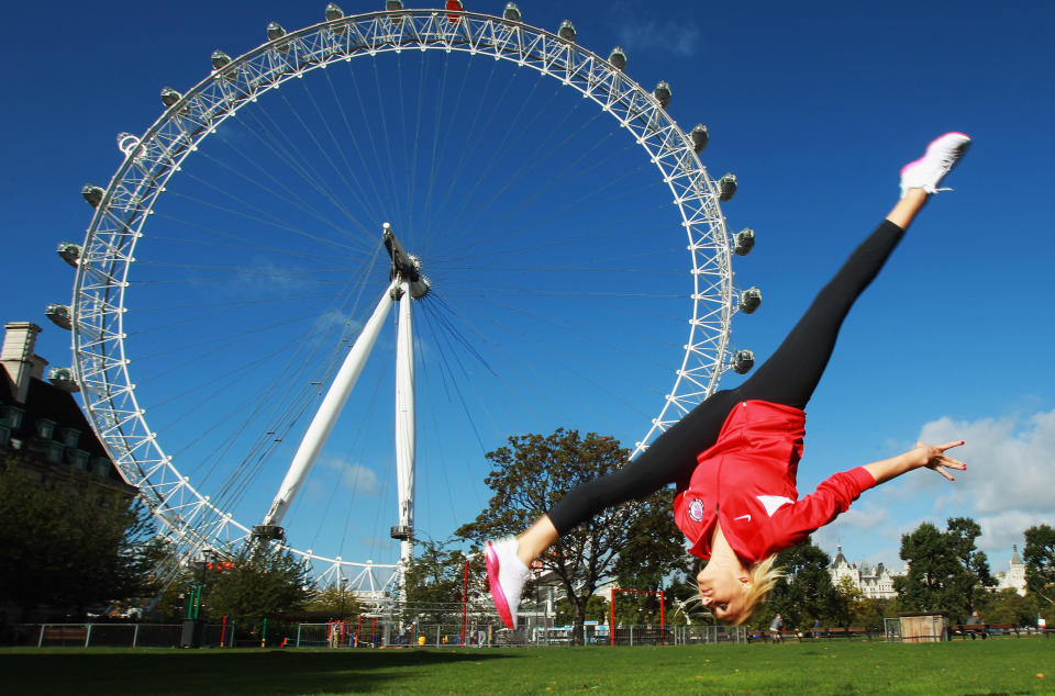 LONDON, ENGLAND - SEPTEMBER 13: Gymnast Nastia Liukin of the USA poses by the London Eye during a tour of London on September 13, 2011 in London, England. (Photo by Bryn Lennon/Getty Images for USOC)