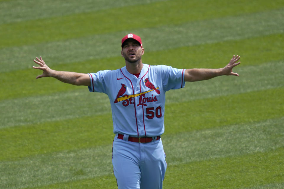 St. Louis Cardinals starting pitcher Adam Wainwright stretches in right field before a baseball game against the Chicago White Sox Saturday, Aug. 15, 2020, in Chicago. (AP Photo/Charles Rex Arbogast)