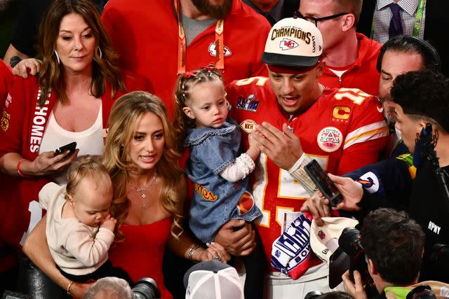<p>PATRICK T. FALLON/AFP via Getty</p> Patrick Mahomes with his family after Super Bowl win.