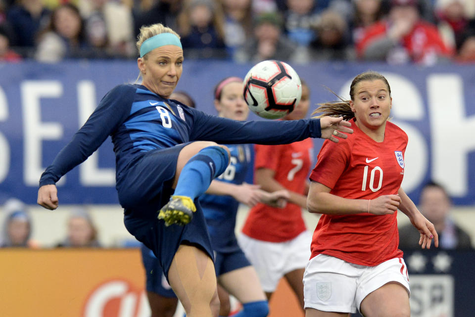 United States midfielder Julie Ertz (8) kicks the ball down field as England forward Fran Kirby (10) moves in during the first half of a SheBelieves Cup women's soccer match Saturday, March 2, 2019, in Nashville, Tenn. (AP Photo/Mark Zaleski)