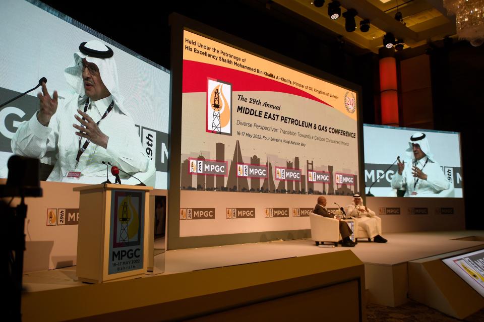 Abdulaziz bin Salman Al Saud is shown on large screens behind the stage at the Middle East Petroleum & Gas Conference.