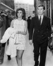 <p>Raquel Welch married Hollywood producer Patrick Curtis in Paris, in 1967. In true ’60s style, the bride wore a white crochet mini dress with a cropped white fur coat and gloves.</p>