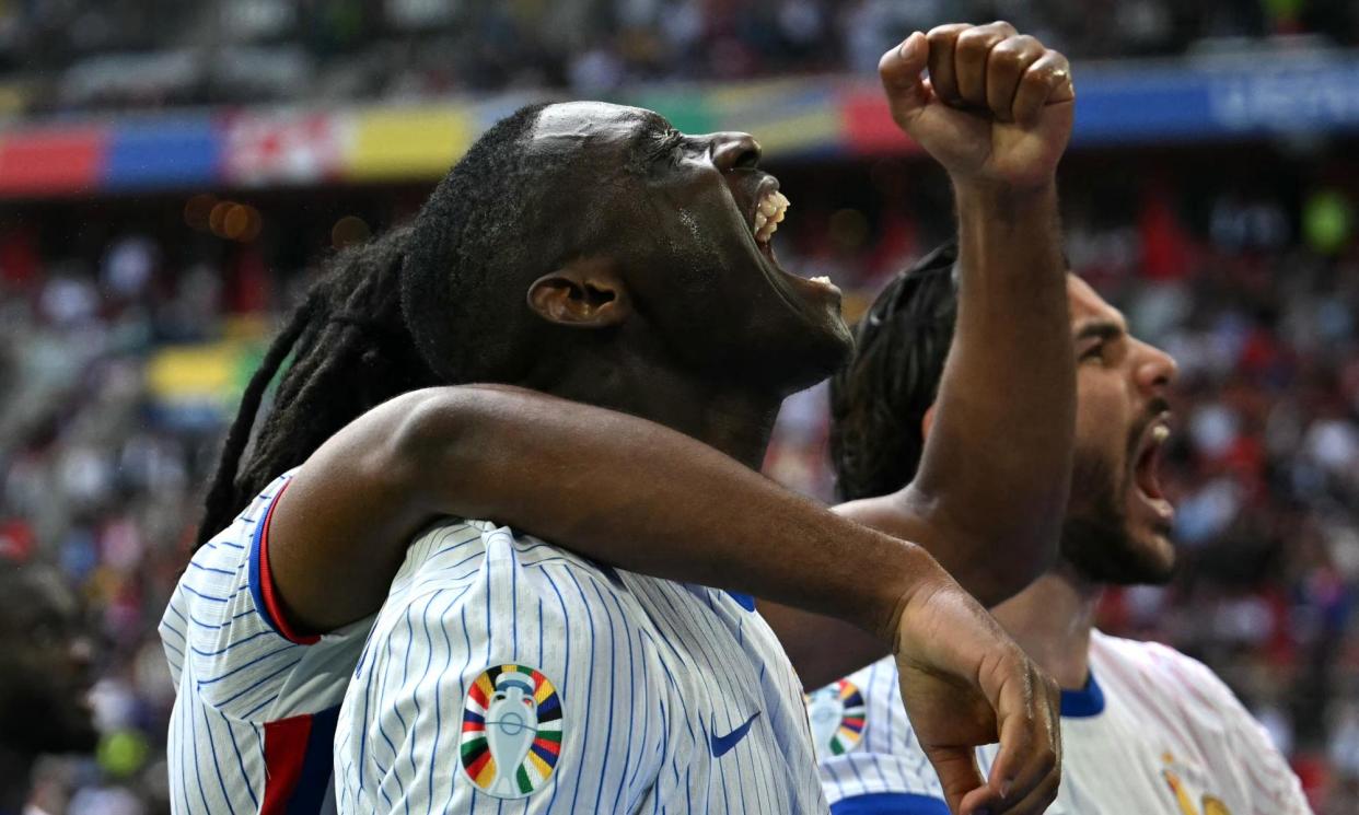 <span>Randal Kolo Muani (centre) celebrates after his shot was deflected into the net by Jan Vertonghen to give France victory over Belgium.</span><span>Photograph: Ozan Köse/AFP/Getty Images</span>