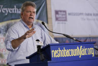 FILE - In this Aug. 1, 2019 file photo, Democrat Attorney General Jim Hood, a candidate for governor, addresses the crowd at the Neshoba County Fair in Philadelphia, Miss. While Democrats in Washington charge ahead with an impeachment inquiry, their party's candidates for governor in three Southern states, including Hood, are doing their best to steer the conversation away from Republican President Donald Trump and toward safer ground back home. (AP Photo/Rogelio V. Solis, File)