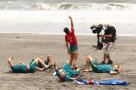 <p>Sally Fitzgibbons of Team Australia celebrates with coaching staff after winning her Women's Round 3 heat on day three of the Tokyo 2020 Olympic Games at Tsurigasaki Surfing Beach on July 26, 2021 in Ichinomiya, Chiba, Japan. (Photo by Ryan Pierse/Getty Images)</p> 