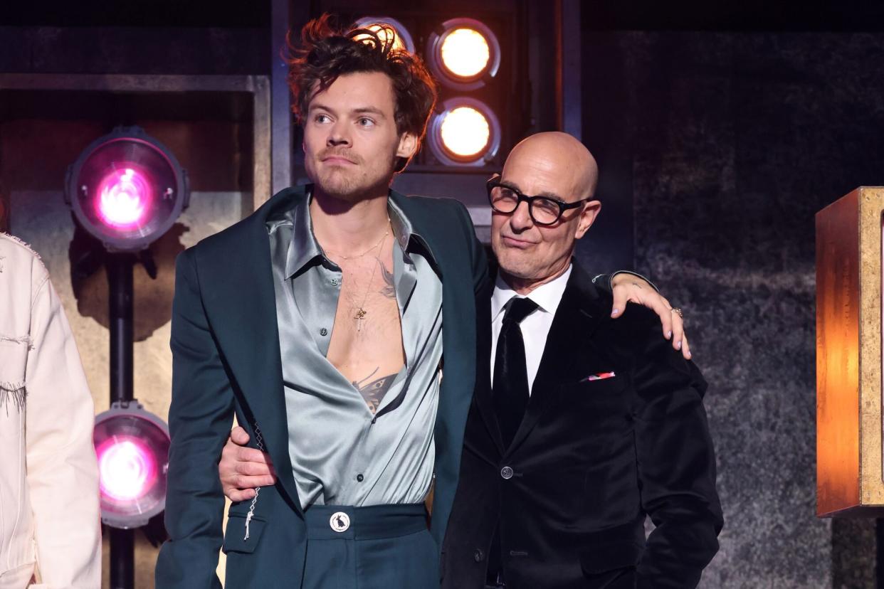 LONDON, ENGLAND - FEBRUARY 11: EDITORIAL USE ONLY Stanley Tucci (R) presents the award for Mastercard Album of the Year to Harry Styles (L) on stage during The BRIT Awards 2023 at The O2 Arena on February 11, 2023 in London, England. (Photo by JMEnternational/Getty Images)