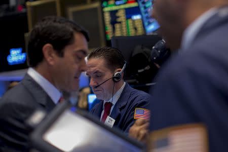 Traders work on the floor of the New York Stock Exchange October 5, 2015. REUTERS/Brendan McDermid