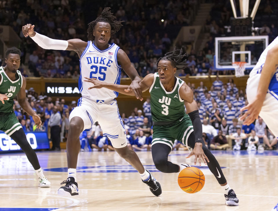 Jacksonville's Kevion Nolan (3) drives against Duke's Mark Mitchell (25) during the first half of an NCAA college basketball game in Durham, N.C., Monday, Nov. 7, 2022. (AP Photo/Ben McKeown)