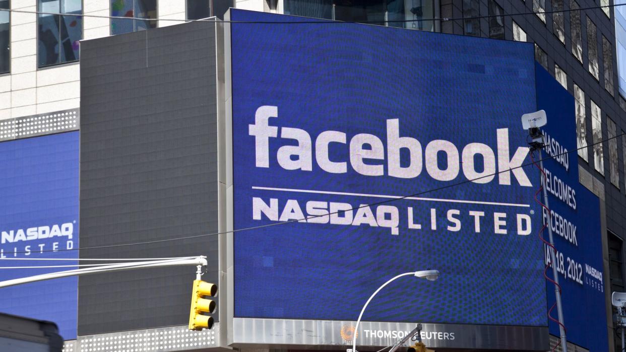 NEW YORK - MAY 18: Sign announcing Facebook IPO is flashed on a screen outside the Thomson Reuters building at the opening bell in Times Square on May 18, 2012 in New York City.