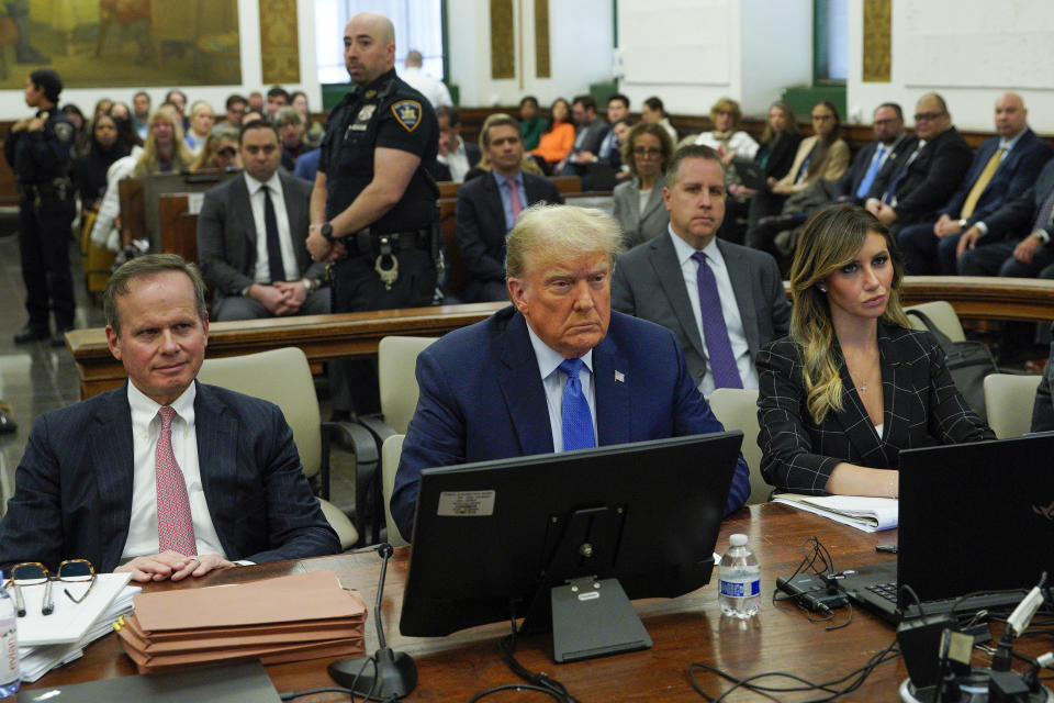 Flanked by his attorneys Chris Kise, left, and Alina Habba, former President Donald Trump waits to take the witness stand at New York Supreme Court, Monday, Nov. 6, 2023, in New York. (AP Photo/Eduardo Munoz Alvarez)