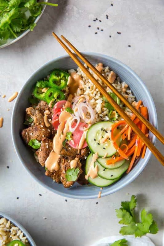 <p>Spoonful of Flavor</p><p>Try this Banh Mi rice bowl recipe for a twist on the classic banh mi sandwich, but without the bread! The bowl is made with pork tenderloin, pickled veggies, brown rice and Sriracha mayo.</p><p><strong>Get the recipe: <a href="https://www.spoonfulofflavor.com/banh-mi-rice-bowl/" rel="nofollow noopener" target="_blank" data-ylk="slk:Bahn Mi Rice Bowl;elm:context_link;itc:0;sec:content-canvas" class="link ">Bahn Mi Rice Bowl</a></strong></p>