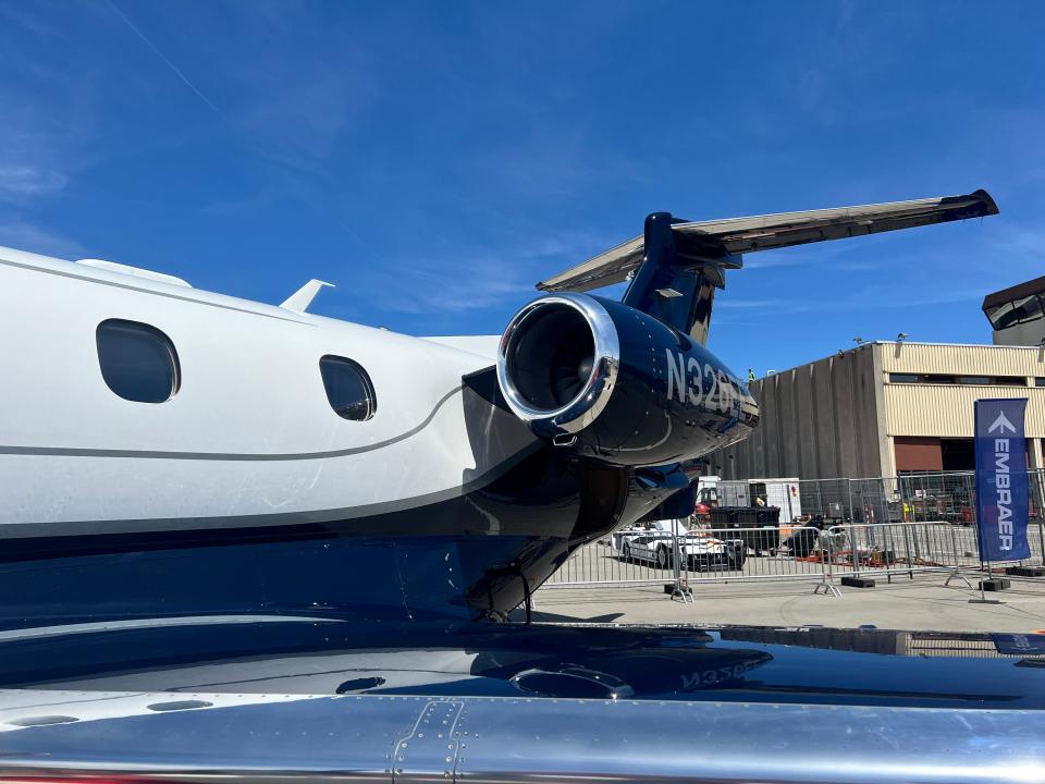 A close up of the engine of an Embraer Phenom 300E on display at EBACE 2024