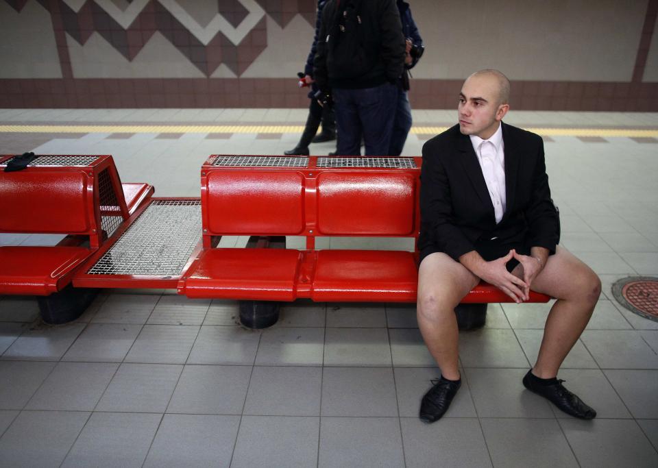 Passenger without his pants waits for a subway train during the "No Pants Subway Ride" event in Sofia