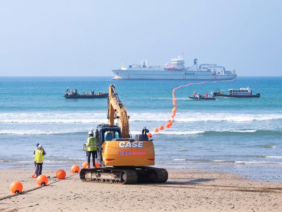 Engineers land Google's Grace Hopper cable on the beach in Bude, UK.