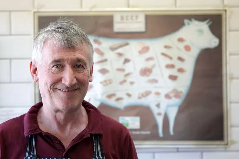 Butcher Kevin McDermott behind the counter of his stall on Radcliffe Market