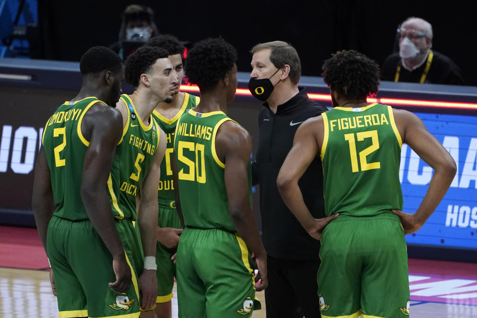 Oregon head coach Dana Altman talks during a timeout the first half of a men's college basketball game against Iowa in the second round of the NCAA tournament at Bankers Life Fieldhouse in Indianapolis, Monday, March 22, 2021. (AP Photo/Paul Sancya)