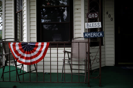 A sign reads "God Bless America" next to the Divine Redeemer Catholic Church in Mt. Carmel, Pennsylvania, U.S., August 17, 2018. Picture taken August 17, 2018. REUTERS/Carlos Barria