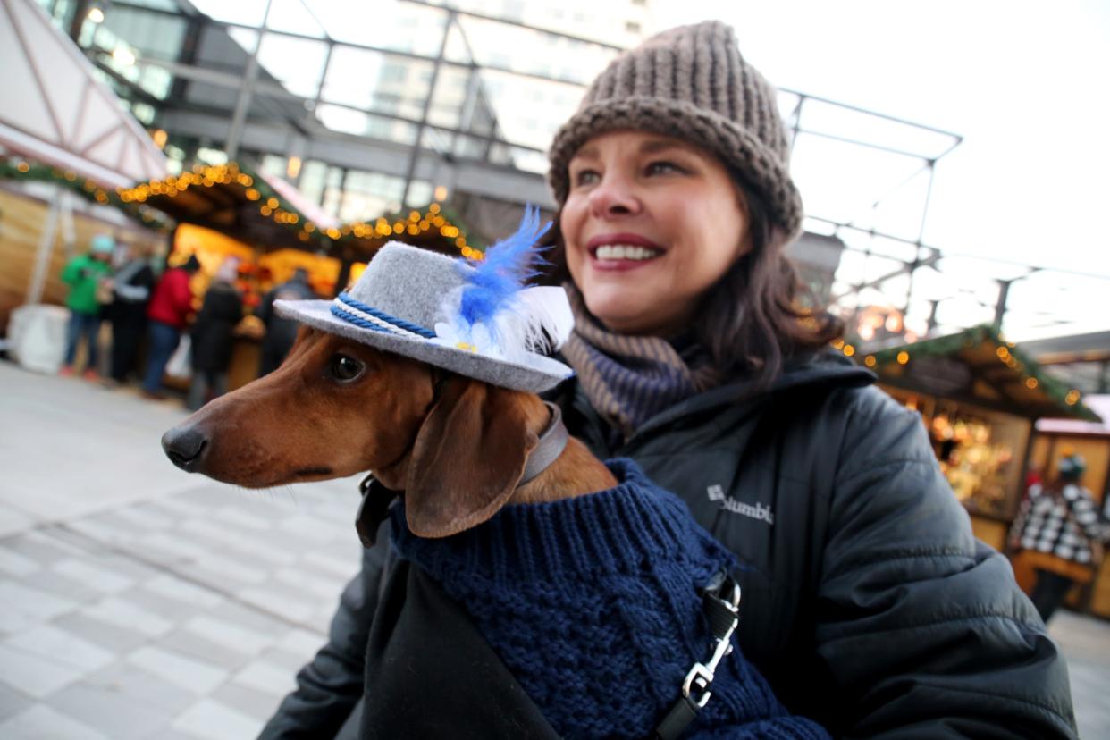 Nan Bonyata of Lake Geneva holds Huck, her dachshund, who was decked out in a traditional German hat in 2018.