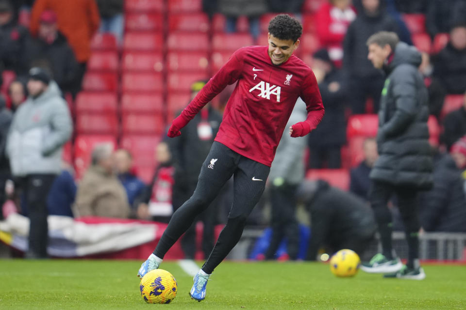 Liverpool's Luis Diaz warms up prior to the English Premier League soccer match between Liverpool and Brentford at Anfield stadium in Liverpool, England, Sunday, Nov. 12, 2023. (AP Photo/Jon Super)