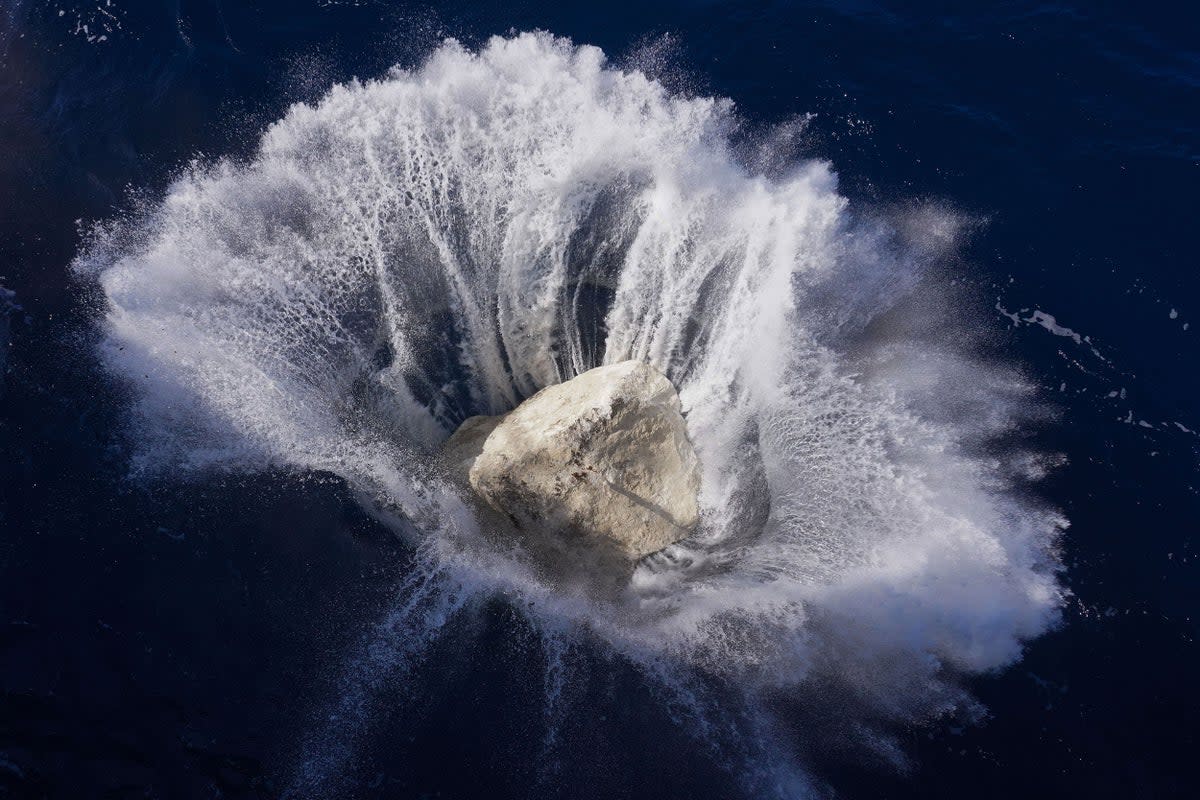 The Arctic Sunrise dropping boulders into the English Channel (Kristian Buus/Greenpeace) (PA Media)