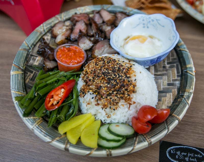 A plate of Iberico Charsiew on Rice with Onsen Egg and Chilled Kang Kong