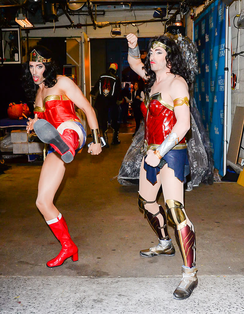 <p>Stay off their property! The HGTV stars looked twice as fierce in their twin Wonder Woman costumes outside the <em>Live With Kelly and Ryan</em> studio on Halloween. (Photo: Raymond Hall/GC Images) </p>