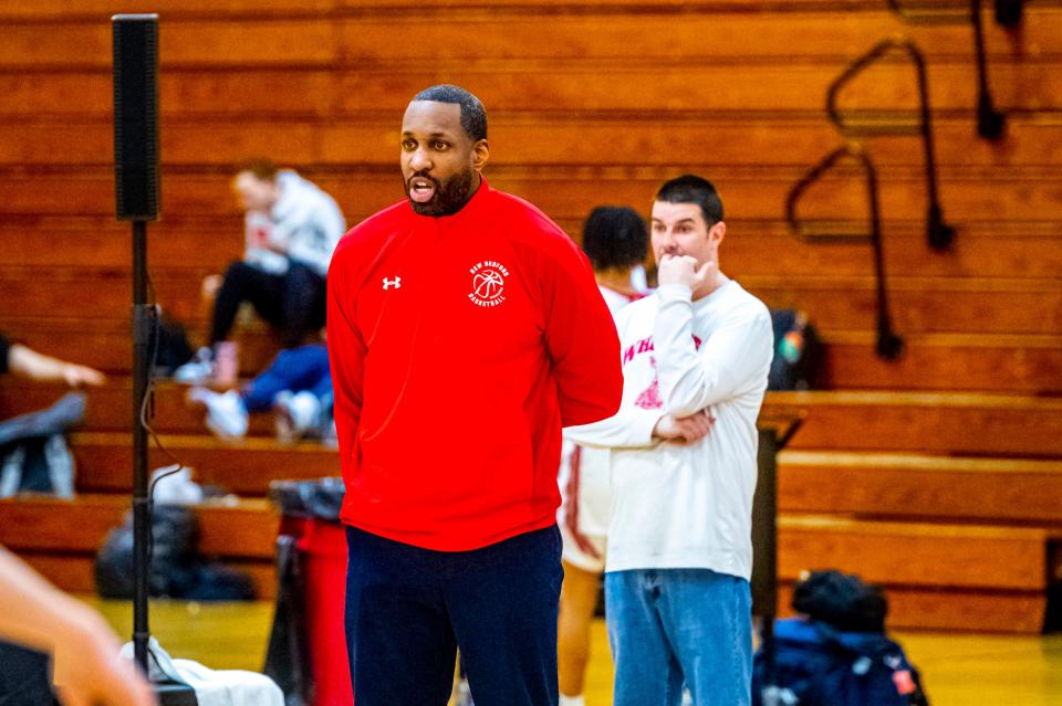 New Bedford coach Matt Hill watches from the sidelines.