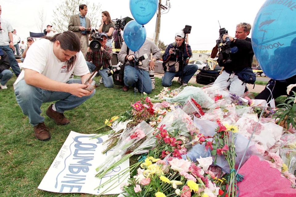 Bob Crazy Bear of Thornton says a prayer on April 21, 1999 outside a memorial for the victims of the Columbine High School massacre. (AFP/Getty Images)