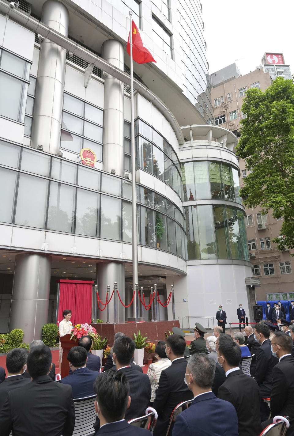 Hong Kong Chief Executive Carrie Lam speaks during an opening ceremony for the China's new Office for Safeguarding National Security in Hong Kong, Wednesday, July 8, 2020. China's new national security office in Hong Kong got off to an early start on Wednesday with an official opening amidst heavy police presence. The new Chinese office in Hong Kong has taken over the Metropark Hotel, owned by the China Travel Service, in the now fashionable neighborhood of Tai Hang, close to Causeway Bay. (Hong Kong Government Information Services via AP)