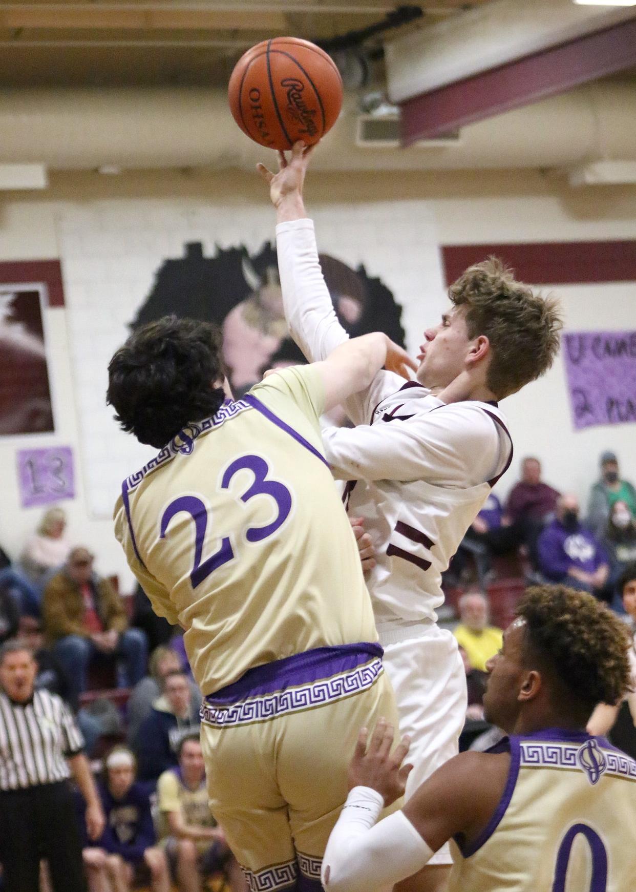 Waterloo's Luke Simons, right, puts up a shot defended by Sebring's Caden Shepherd Friday, January 28, 2022.