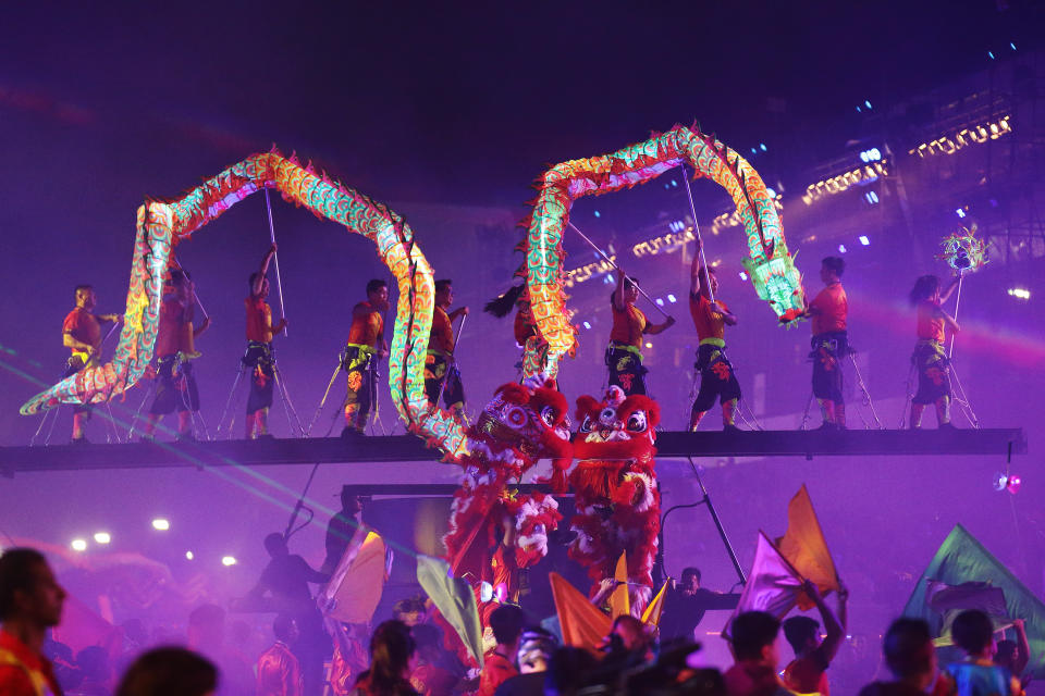 SINGAPORE - JANUARY 31:  A liona dn dragon dance troupe perform during the 'Colours in Harmony', Chingay Parade at the F1 Pit Building on January 31, 2020 in Singapore. The Chingay Parade started in 1973 and was originally a neighbourhood parade but over the years has evolved into one of the biggest street parades in Asia.  (Photo by Suhaimi Abdullah/Getty Images)