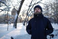 Participant of rally in support of Russian opposition politician Navalny, Anton, poses in St Petersburg