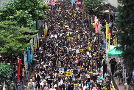 People march during a rally to demand democracy and political reforms in Hong Kong