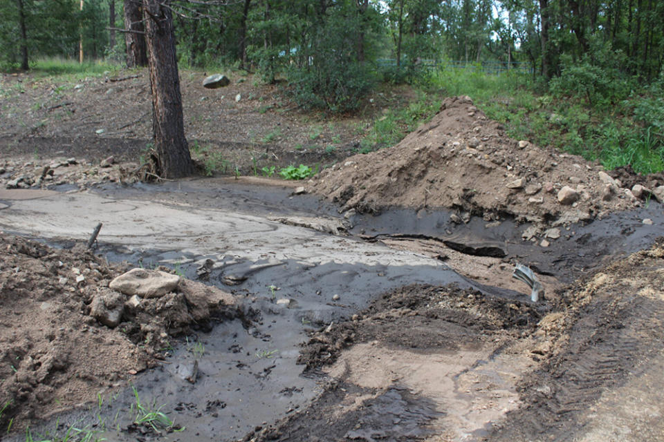 Flooding has created silt and clogged up a culvert by a road at Collins Lake Ranch. Pictured on Monday, Sept. 12. (Photo by Megan Gleason / Source NM)