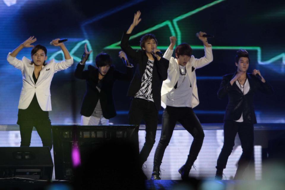 Kpop group "UKISS" performs for the crowd during the "Dream Kpop Fantasy Concert" held at the Mall of Asia grounds in Pasay city, south of Manila on 19 January 2013. (George Calvelo/NPPA Images)