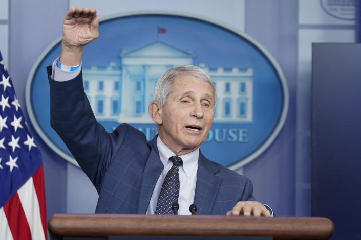 Dr. Anthony Fauci stands at a podium at the White House.