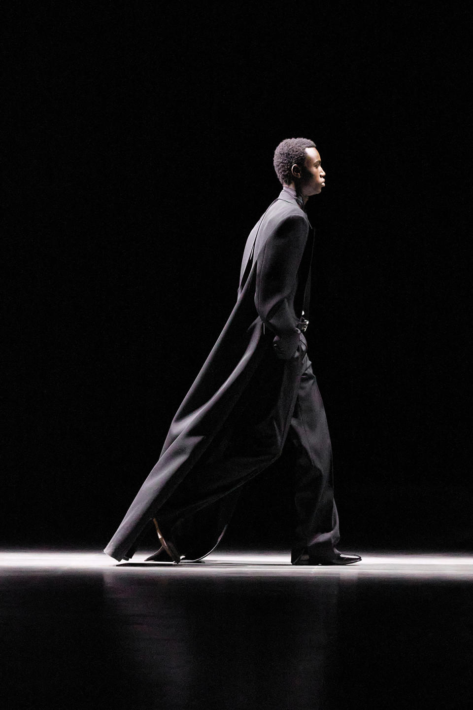 A dramatic black wool formal coat from Gucci.