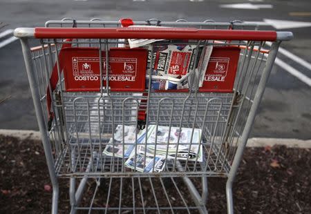 An empty shopping cart is seen in a shopping center parking lot in Westbury, New York November 27, 2015. REUTERS/Shannon Stapleton