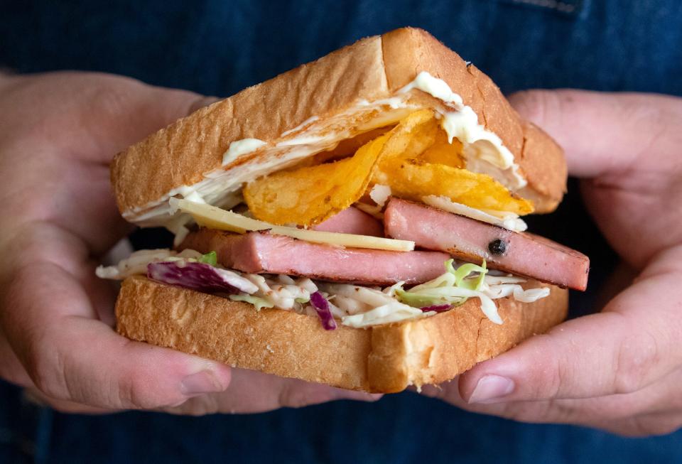 Meet the Lunchbox, the grilled mortadella sandwich from the downtown pop-up Meat & Co. It's stacked with aged cheddar, Dijon slaw, Duke's mayonnaise and Zapp's Voodoo Chips.