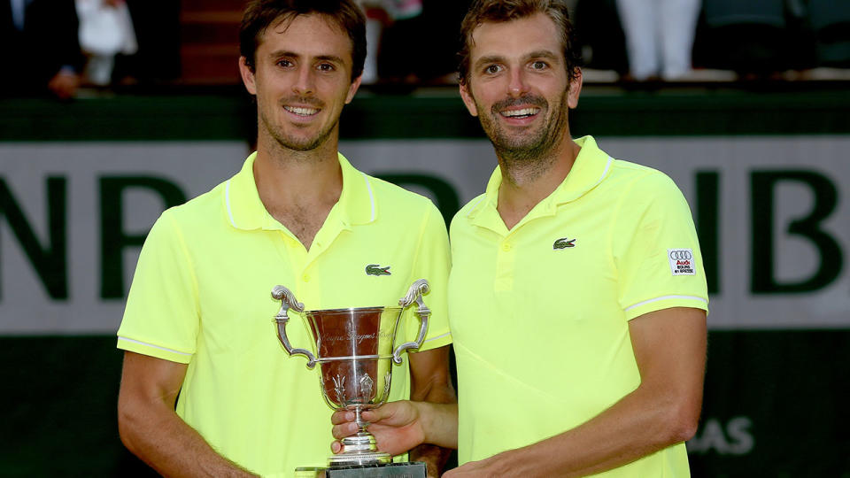 Julien Benneteau (R) and Edouard Roger-Vasselin won the 2014 French Open doubles. (Photo by Matthew Stockman/Getty Images)