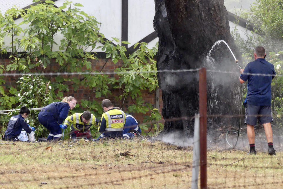 Crews treat woman after she was struck by lightning near Sydney.