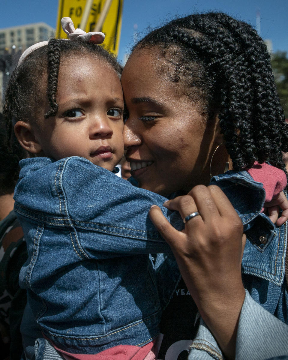 Nathalie David with her daughter at the Global Climate Strike in New York City. (Photo: Kelly Matousek for Verizon Media)