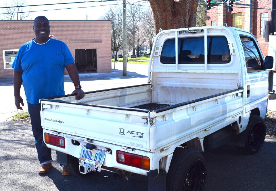 David Newberry-Yokley stands by the vehicle he plans to convert into a food truck to take his soul-b-q meals on the road.