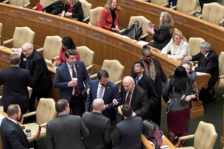 Former Arkansas governor and U.S. Sen. David Pryor walks into the Arkansas House chamber at the state Capitol in Little Rock, Ark. on Tuesday, Jan. 10, 2023 with state Sen. Clarke Tucker for the swearing in of Sarah Huckabee Sanders as governor. Pryor died on Saturday, April 20, 2024 of natural causes at the age of 89. (AP Photo/Andrew DeMillo)