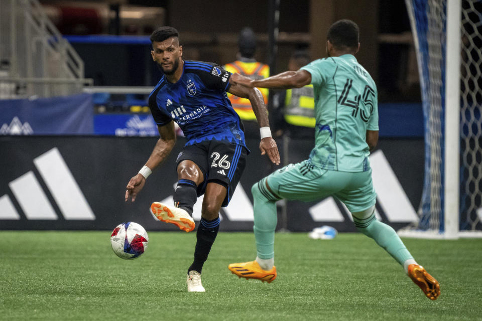 San Jose Earthquakes' Rodrigues (26) kicks the ball past Vancouver Whitecaps' Pedro Vite (45) during first-half MLS soccer match action in Vancouver, British Columbia, Sunday, Aug. 20, 2023. (Ethan Cairns/The Canadian Press via AP)