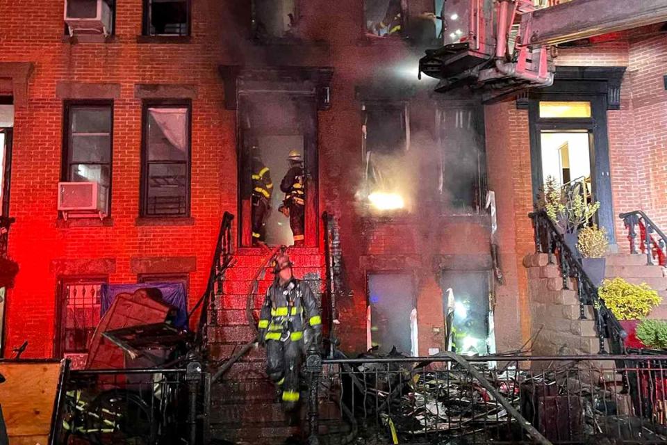 <p>FDNY/Instagram</p> A Crown Heights brownstone photographed up in flames while firefighters attempt to control the blaze