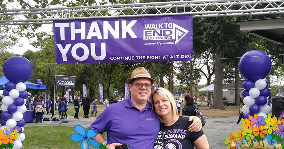 This undated image released by the Alzheimer's Association shows Kim and Jeff Borghoff, pose at a fundraising event for the Alzheimer’s Association. For Kim Borghoff and her family, keeping a tradition of Sunday meals helped maintain a sense of normalcy as her husband and his father were simultaneously struggling with Alzheimer's disease. (Hugh Acheson/Alzheimer's Association via AP)