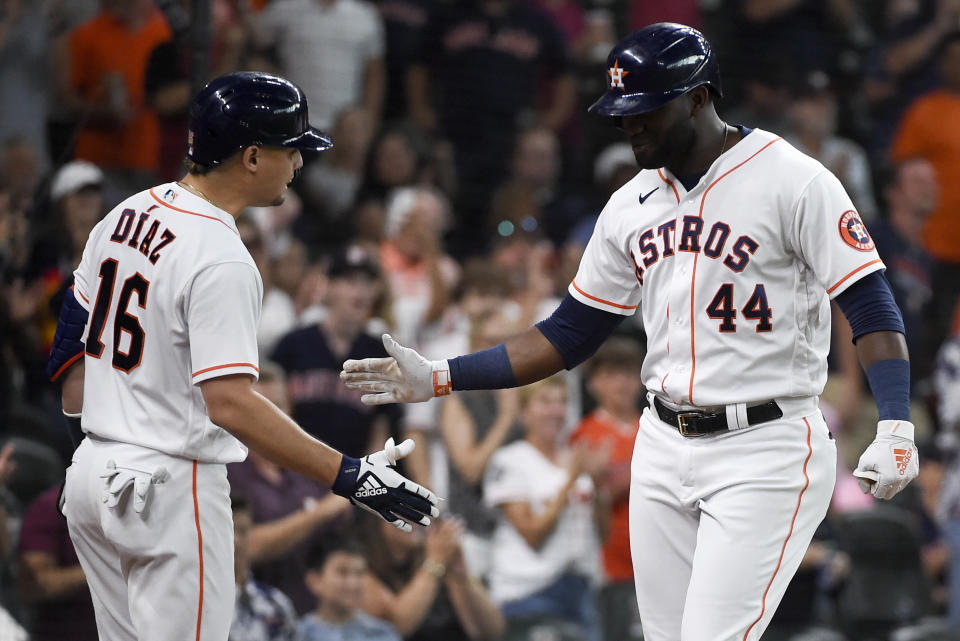 Houston Astros' Yordan Alvarez (44) celebrates his solo home run with Aledmys Diaz during the fourth inning of a baseball game against the Minnesota Twins, Saturday, Aug. 7, 2021, in Houston. (AP Photo/Eric Christian Smith)