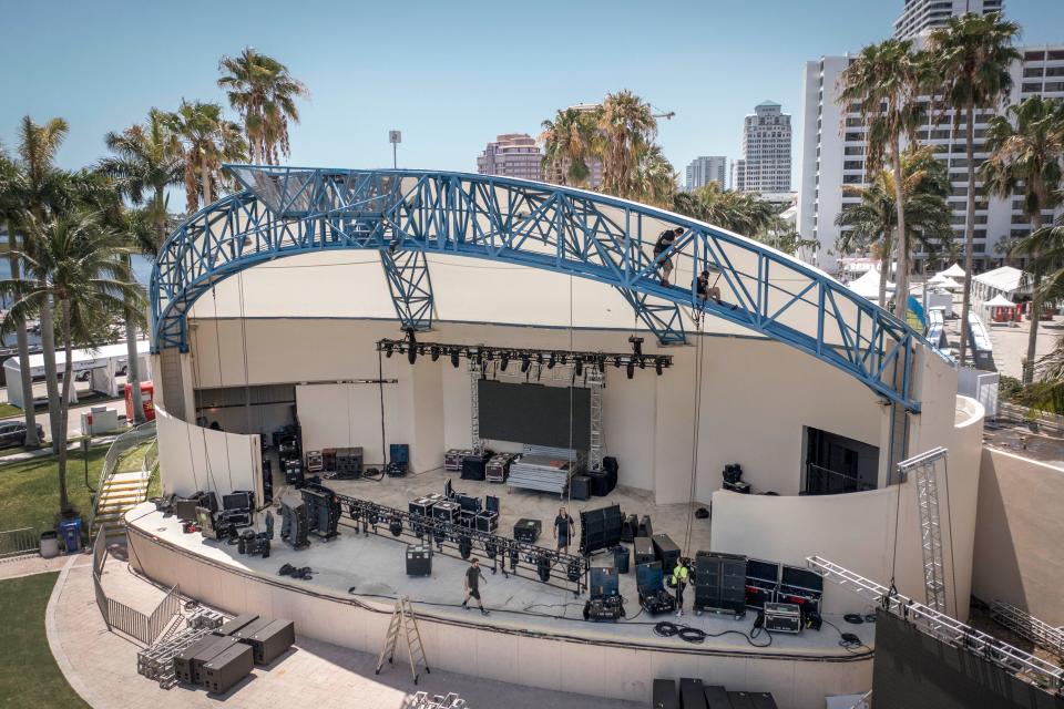 Workers set up the Ideal Nutrition Stage for Sunfest in West Palm Beach, Florida on May 4, 2023. 